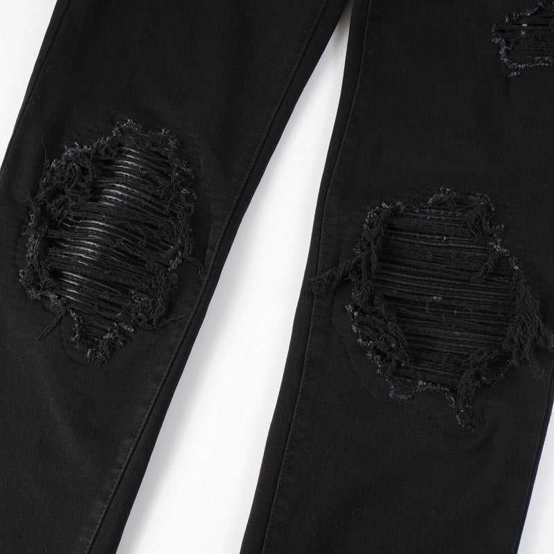 Schwarze Jeans mit Lederpatches