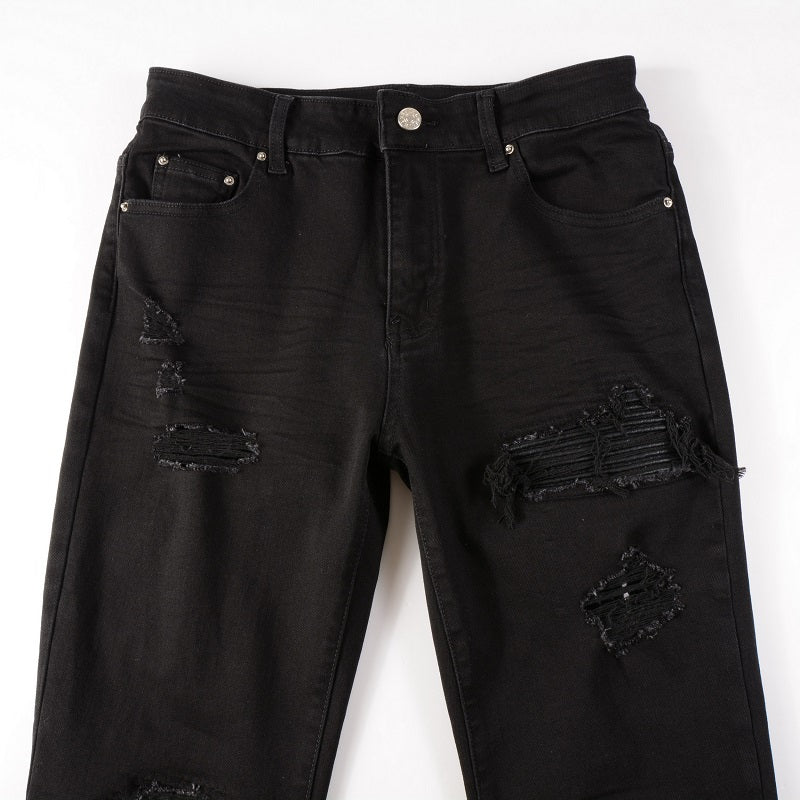 Schwarze Jeans mit Lederpatches