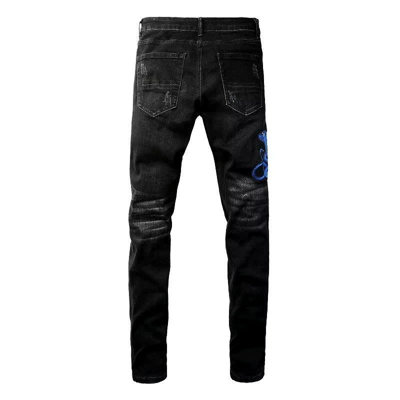 Schwarze Distressed-Jeans mit Schlangenstickerei